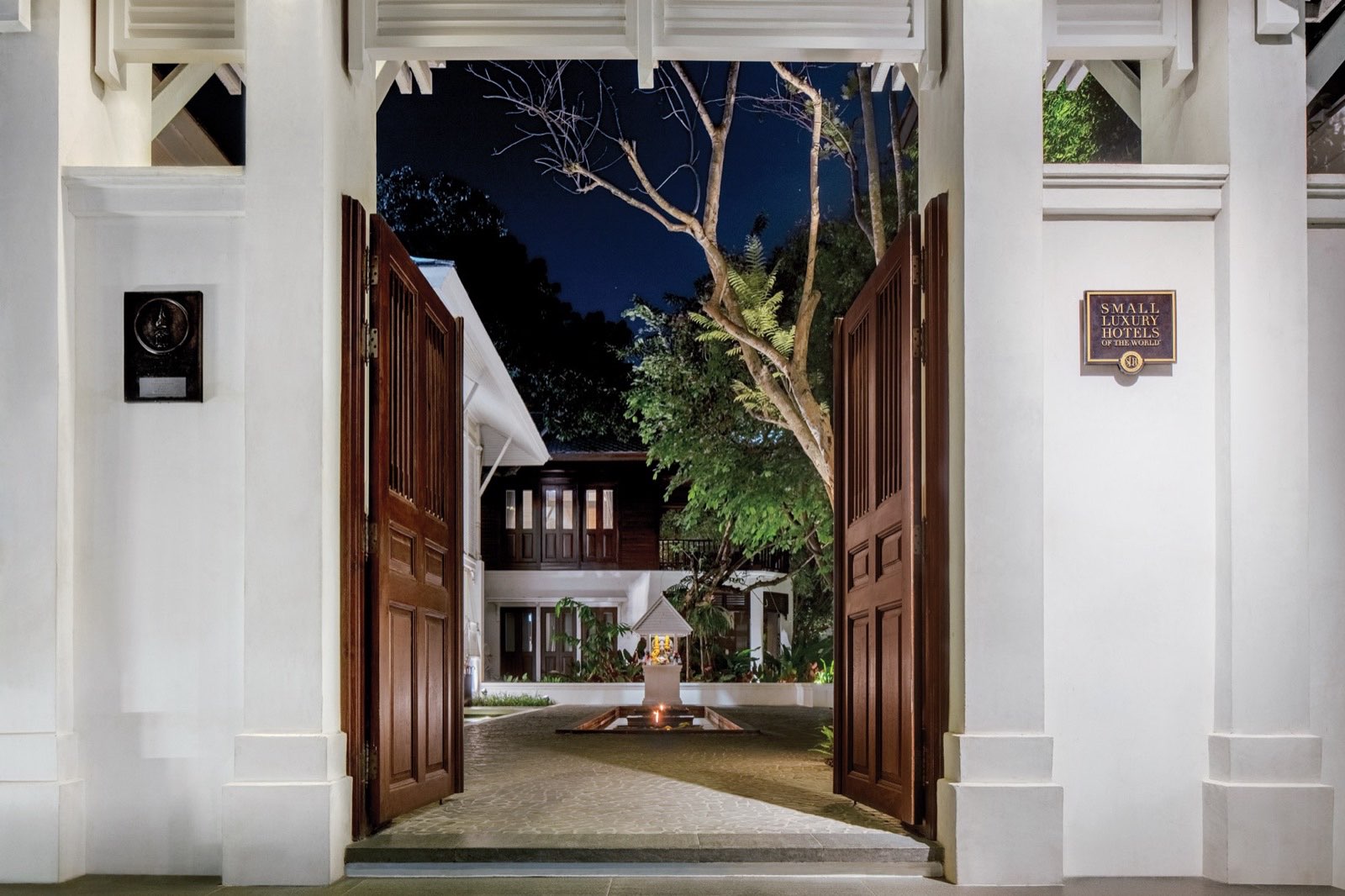 The entrance to 137 Pillars House, Chiang Mai, at dusk